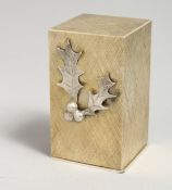 A STUART DEVLIN SILVER BOXED ANGEL AND HOLLY, 1974. 2.5ins.