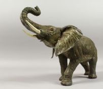 A VIENNA PAINTED BRONZE ELEPHANT, 12ins long.