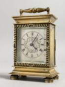 A GOOD SMALL BRASS CLOCK with verge movement, HAM NICHOLLS, CANTERBURY, NO. 2188. 5ins high with
