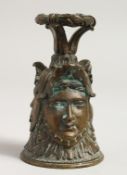 A CLASSICAL BRONZE BELL with three faces. 4ins high.
