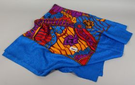 AN YVES ST LAURENT SILK SCARF. Red, blue and yellow flower and scroll design. 120ins x 112ins