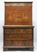AN 18TH CENTURY WALNUT ESCRITOIRE, with a frieze drawer above the fall flap, enclosing a small