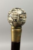 A CARVED BONE HANDLED WALKING STICK, with globe compass,. 37ins long.