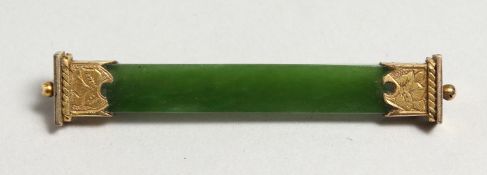 A JADE AND SILVER GILT BROOCH.