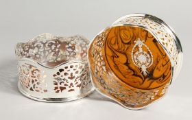 A PAIR OF PIERCED PLATE AND FAUX TORTOISE SHELL WINE COASTERS.