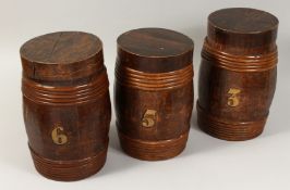 THREE WOODEN BARRELS AND COVERS, Nos.3-5-6. 21ins high.