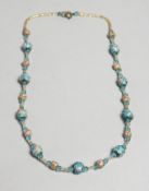 A TINY ISLAMIC NECKLACE.