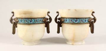 A VERY GOOD PAIR OF 19TH CENTURY FRENCH ONYX URNS with ormolu handles and champleve enamel band 2ins