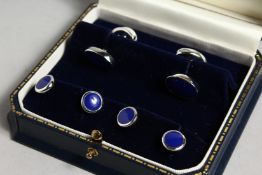 A SILVER AND LAPIS STUD AND CUFF LINK SET.