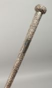 A BURMESE SILVER HANDLED CANE. 15ins long.