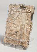 A VICTORIAN AMERICAN SILVER CALLING CARD CASE depicting a cathedral in high relief. 3.25ins x 2.2