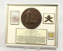 A FRAMED AND GLAZED WW1 BRONZE MEMORIAL DEATH PLAQUE or 