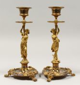 A GOOD PAIR OF 19TH CENTURY, ORMOLU AND CHAMPLINE ENAMEL CLASSICAL CANDLESTICKS, as classical