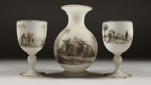 A RICHARDSONS FROSTED GLASS EWER AND A PAIR OF GOBLETS, with enamel decoration, Arab scenes (3).