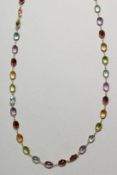 AN 18CT YELLOW GOLD MULTI COLOURED GEM SET NECKLACE