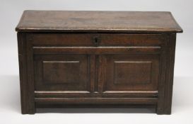 AN 18TH CENTURY OAK COFFER, with plain top, the front with two fielded panels. 3ft 4ins long x 1ft