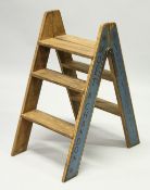 A DOM PERIGNON & BOLLLINGER FOLDING STEPS.