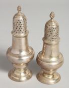 A PAIR OF GEORGE II SUGAR CASTERS. London 1776, Maker, John Deacon 5.5ins high.