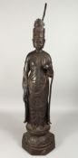A LARGE CHINESE BRONZE GOD with a halo, on an octagonal base, 36ins high.
