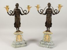 A PAIR OF THOMAS HOPE DESIGN BRONZE CANDELABRA of classical ladies holding scrolling branches, on