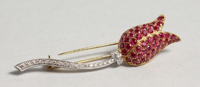 AN 18CT WHITE AND YELLOW GOLD TULIP BROOCH set with rubies and diamonds.