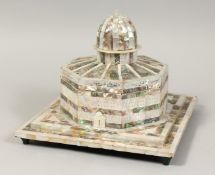 A FINE MOTHER OF PEARL ISLAMIC TEMPLE with calligraphy, the top opening to reveal a red velvet