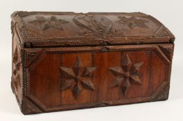 A GOOD TRAMP ART CARVED WOOD, DOMED TOP BOX, carved with a ladder, tools and star motif. 22ins x