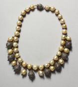 A VERY GOOD STING OF PEARLS with diamond segments.