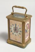 A CARRIAGE CLOCK with painted floral pink flowers.