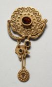 A PATRICIA LOCKE DESIGNER GILT BROOCH..