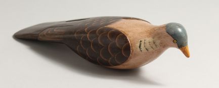 A PAINTED WOODEN BIRD. 13ins long.
