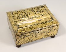 A REGENCY POKERWORK JEWELLERY BOX with fitted interior on four bun feet. 11ins wide.