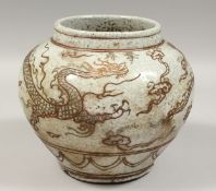 A KOREAN PORCELAIN CIRCULAR DRAGON POT, 8.5ins high.
