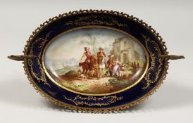 A GOOD 19TH CENTURY SEVRES OVAL COMPORT in an ormolu frame, painted with figures on horseback, two