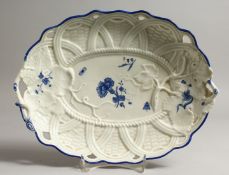 A RARE WORCESTER BASKET WEAVE MOULDED DISH, unusually painted with in dry blue.