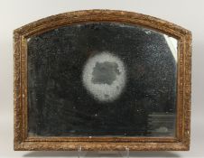 A GOOD EARLY GILDED DOME TOP MIRROR in a hand carved frame. 25ins x 31ins.