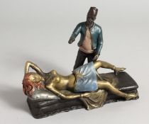 A PAINTED COLDCAST BRONZE ARAB with semi nude. 7ins long.