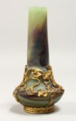 A SMALL ART NOUVEAU DESIGN MOTTLED GREEN GLASS BOTTLE VASE, overlaid with ormolu and mounts. 6ins