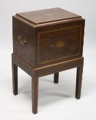 A REGENCY MAHOGANY CELLARETTE ON A STAND with rising top and fitted interior for twelve bottless.