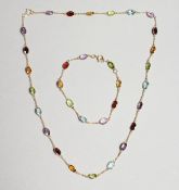 AN 18CT YELLOW GOLD 18 CT. MULTI GEM SET NECKLACE AND CHAIN.