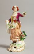 AN 18TH CENTURY DERBY FIGURE OF A SHEPERDESS with a sheep dog at her feet.