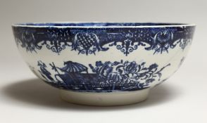 AN 18TH CENTURY POTTERY PEARLEWARE CIRCULAR BOWL with Chinese patterns. 10.5ins diameter, (AF).