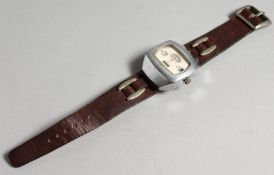 A MAN'S 1950'S WRIST WATCH with leather strap.
