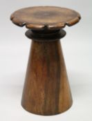 A GOOD ROSEWOOD TAPERING STAND with shaped top. 21ins high, top 13 ins diameter.