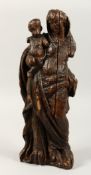 A 17TH CENTURY CARVED WOOD MADONNA AND CHILD. 17ins high.