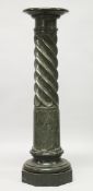 A FINE GREEN MARBLE, SERPENTINE FLUTED COLUMN with revolving top.
