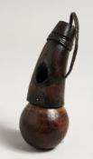 A TRIBAL WOODEN SNUFF BOTTLE OR POWDER FLASK. 5.25ins long.