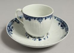 AN 18TH CENTRUY WORCESTER COFFEE CUP, TEABOWL AND SAUCER painted in blue with a large flower and