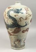 A CHINESE PORCELAIN BLUE AND WHITE DRAGON VASE 18ins high.