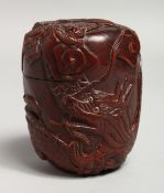 A JAPANESE CARVED WOOD DRAGON BOX AND COVER. 3ins.